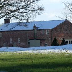 Stable range and 2 cottages to south east of Chorlton Hall