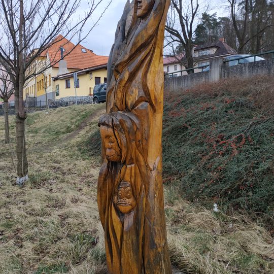 Wood statue before hotel in Týnec nad Sázavou