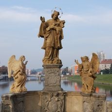 Statue of John of Nepomuk with angels on Písek Stone Bridge