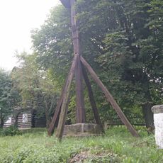 Bell tower, fountain and column in Lhota