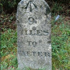 Milestone, 200m S of Mamhead jct just S of sign to Ashcombe cottages and activities on N-bound carriageway
