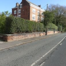 Wall, gate and screen of railings before Salters Well House