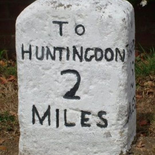 Milestone, Thrapston Road, by No. 102, opp. Grove Lane