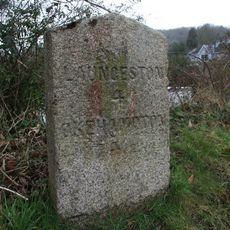 Milestone, New Road, opp "Just a Toll", 100m E of Lifton Hall Hotel