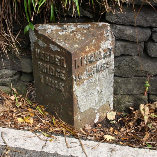 Milestone on east side of road half a mile to north of junction with Midgehole Road