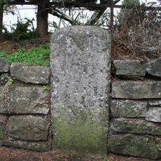 Milestone, Exeter Road, opp. Golden Dragon Restaurant, left of bus shelter