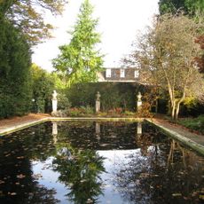Christ's College, Bathing Pool And Summer House, Including The Busts Of Cudworth, Milton And Saunderson And Stone Vase In Memory