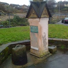 Memorial Stone And Base Of Market Cross Opposite Junction With Combs Road
