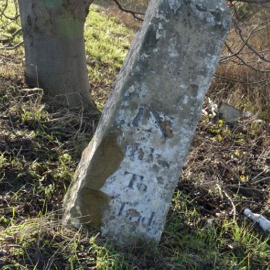 Milestone, N of entrance to School Farm, Chittering