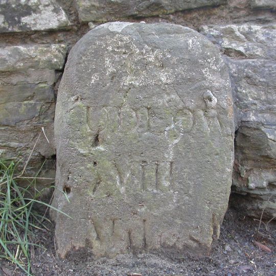 Milestone, by barn at Bache Mill House