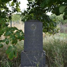 Kříž u autobusové zastávky Plešnice
