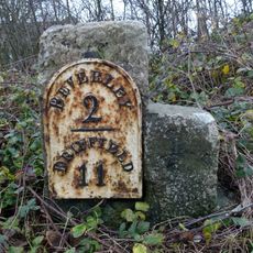 Milestone, N of entrance to Barracks