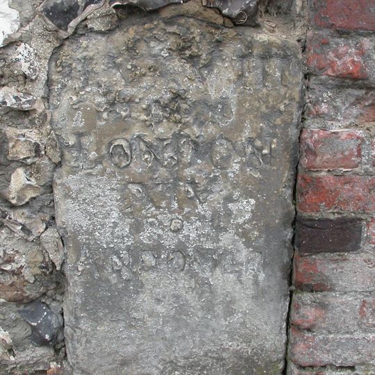 Milestone In Churchyard Wall