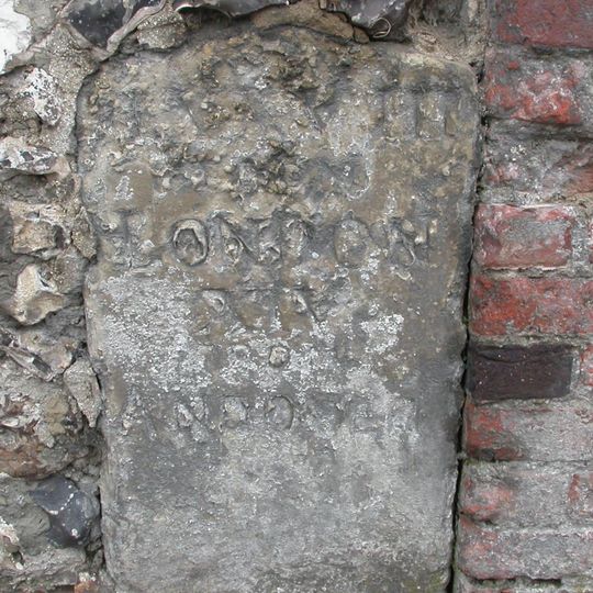 Milestone In Churchyard Wall