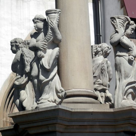 Mariánsky stĺp, socha V.