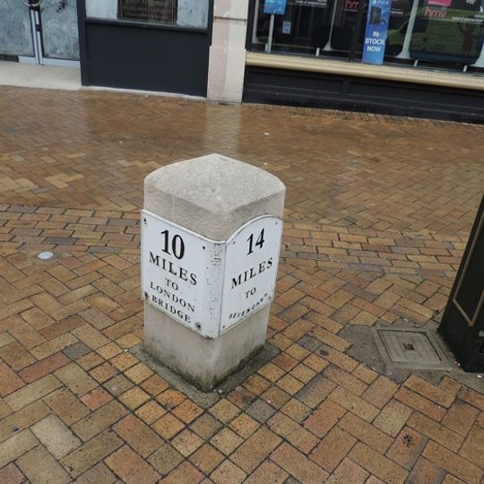 Milestone, High Street, at southern end of pedestrian area, 40m from jct with Elhelberts Road