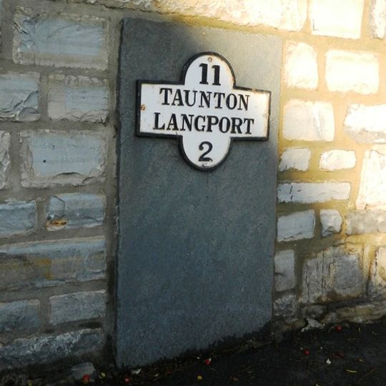Milestone, centre of village, nr jct with B3168, beside war memorial