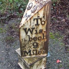 Milepost, opp. jct with B1094, outside "Threeways"