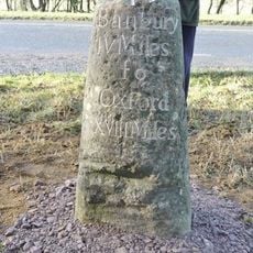Milestone, S of turn to village, North of lay-by