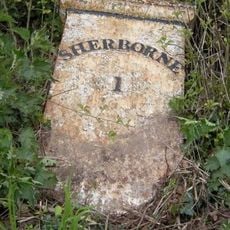 Milepost, N of Sherborne, next to field gate