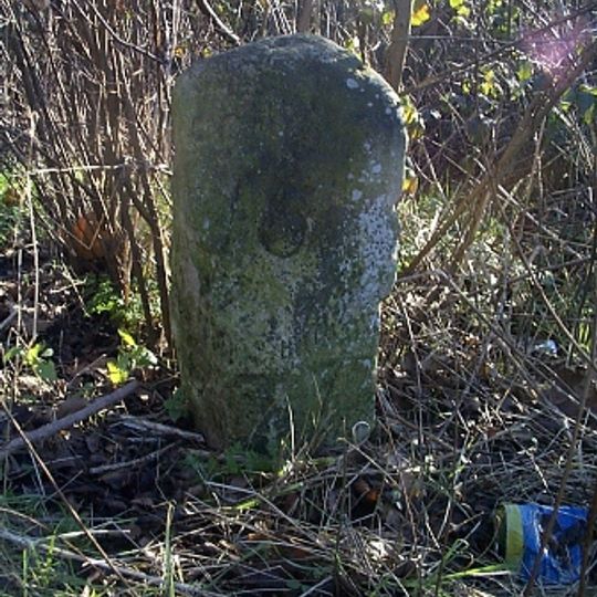 Milestone, High Road, opp jct with Bury Lane