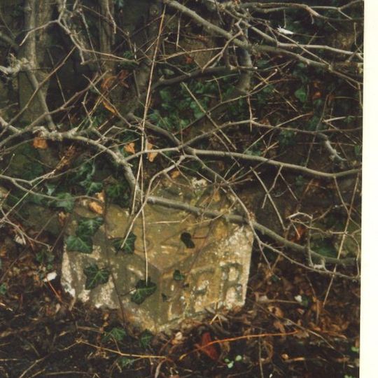 Milepost, roadside at NT999327