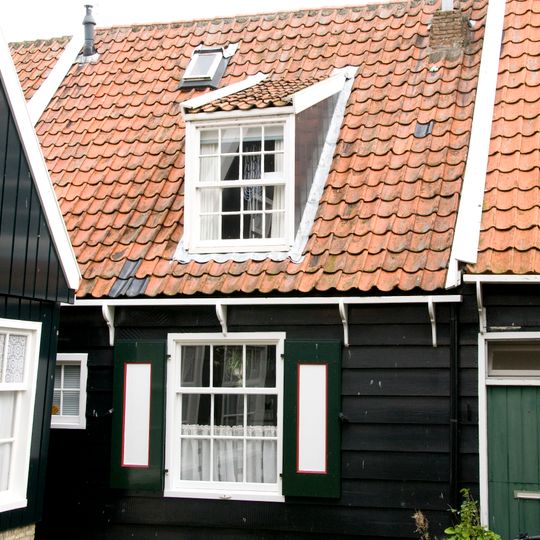 Perceelsgedeelte van een houten huis