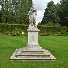 Figure Of Father Time, In Herbaceous Gardens, At Anglesey Abbey