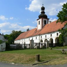 Farmyard building with the tower of St. Florian