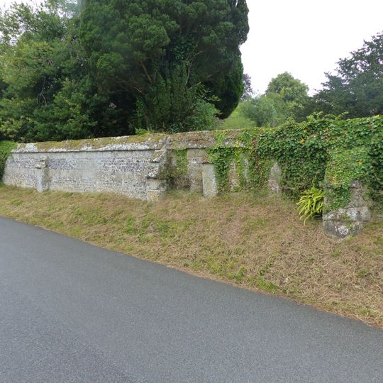 Approximately 25m of churchyard wall to the west and south of St Mary's Church