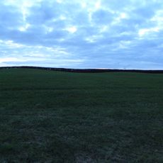 Four bowl barrows and a standing stone 330m west of Higher Mattocks Down