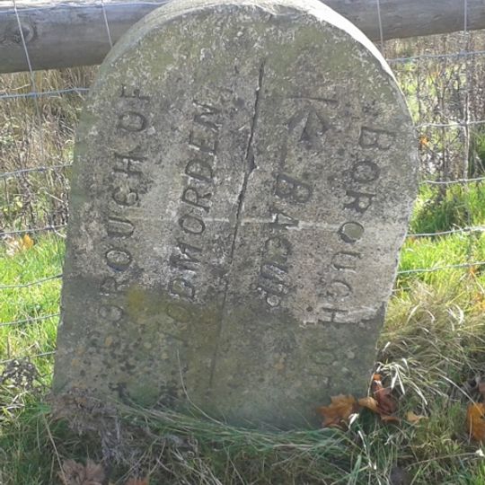 Boundary stone on south side of road opposite Tollhouse