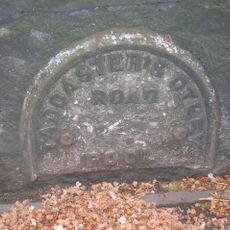 Milestone, Arthington Lane, E end of Pool