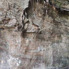 Historic graffiti from 1940-50s inscribed in the rock