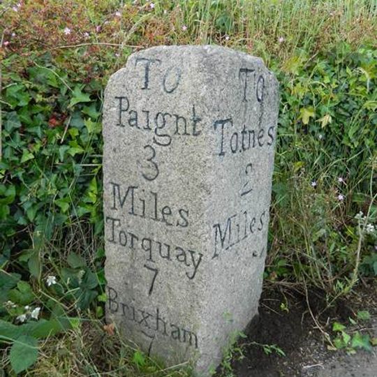 Milestone, Longcombe, 50m E of turn to Stoke Gabiel at Longcombe Cross, opp. South Hams Motor Company