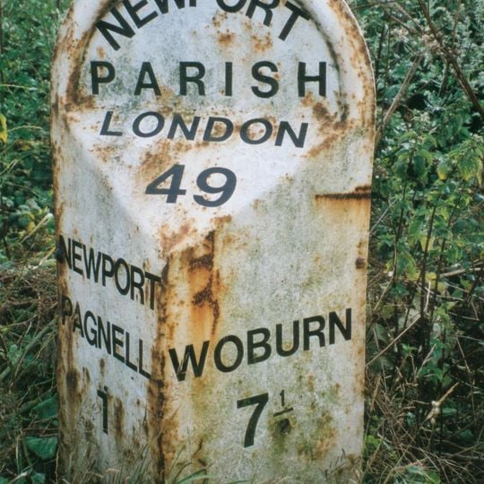 Milepost, London Road; S of Newport Stables, and 300m S of Tickford island