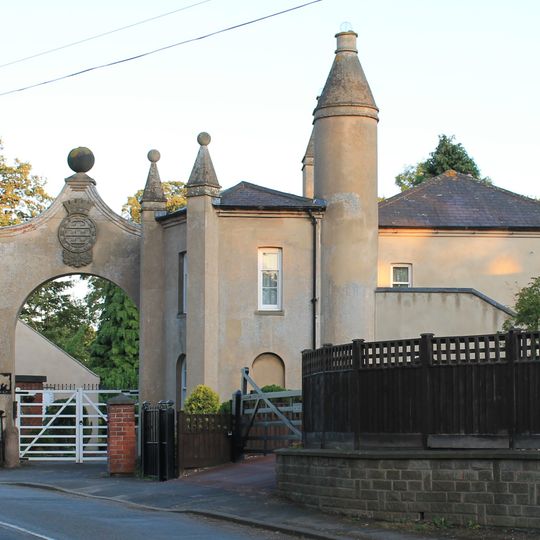 The Lodge And Attached Gateway And Wall