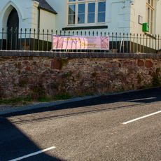 Stone Rubble Retaining Wall And Railings In Front Of The Community Centre And Museum
