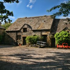 Barn to Home Farm, north west of Downham Hall, and stable in same range to east