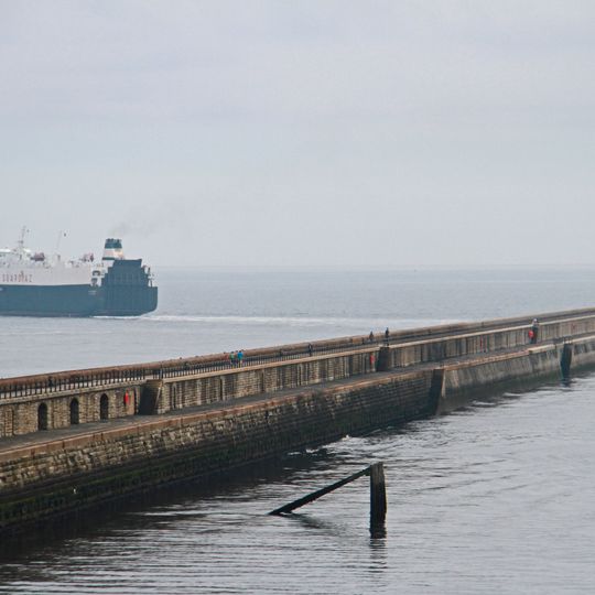 North Pier With Crane Attached And Lighthouse