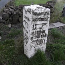 Guide post at junction with A6033