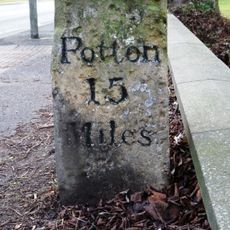 Milestone, London Road, by Limes Park