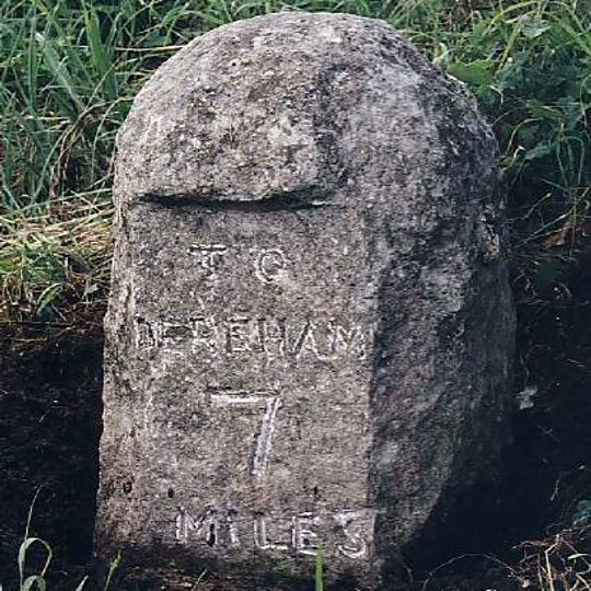 Milestone, 50yds N of track on E