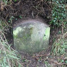 Milestone, Middle Gribble, 50m N of Myrtle Cottage and jct