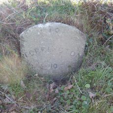 Milestone, 50m S of Friar's Hele Cross jct with old route and new road