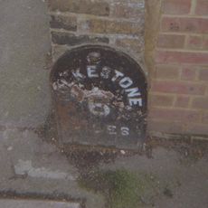 Milestone, Folkestone Road, by No. 239; at jct of Underdown Road