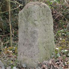 Milestone, Chilton Grove, just W of entrance to airfield