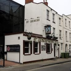 Handel House (Number 51) And St Georges Vaults Public House (Number 53) And Railings