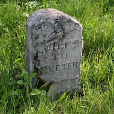 Milestone, Crediton Lane End, 150m E of roundabout at Woodleigh jct