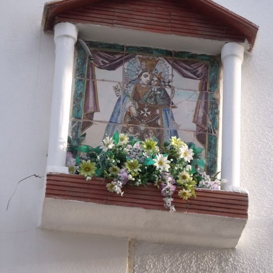 Ceramic panel of Our Lady of the Forsaken at Crist de la Fe street
